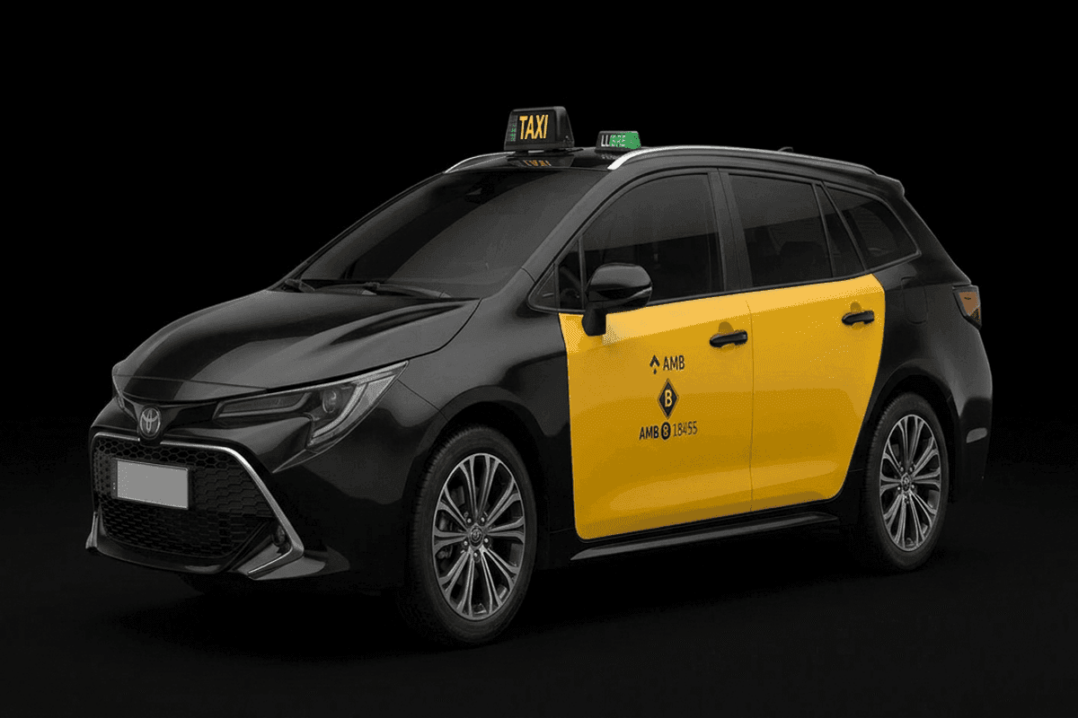 Toyota Corolla Touring Sports estate Barcelona airport taxi in black and yellow AMB livery, seats 4 passengers with 4 suitcases